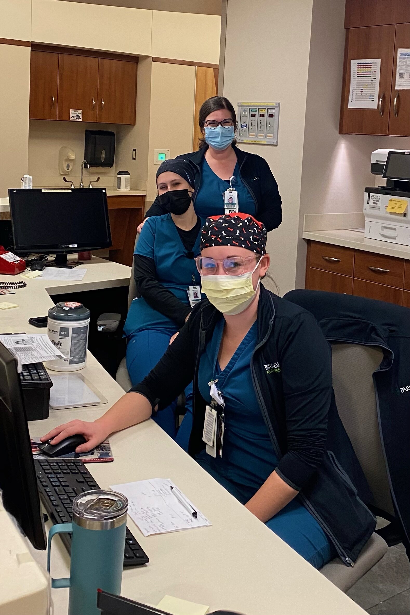 Michaela Weir, pictured in back, is shown during a recent Helping Hands shift with fellow RNs Danielle Gombas, middle, and Kelli Bultemeyer on the ortho trauma unit at Parkview Regional Medical Center.