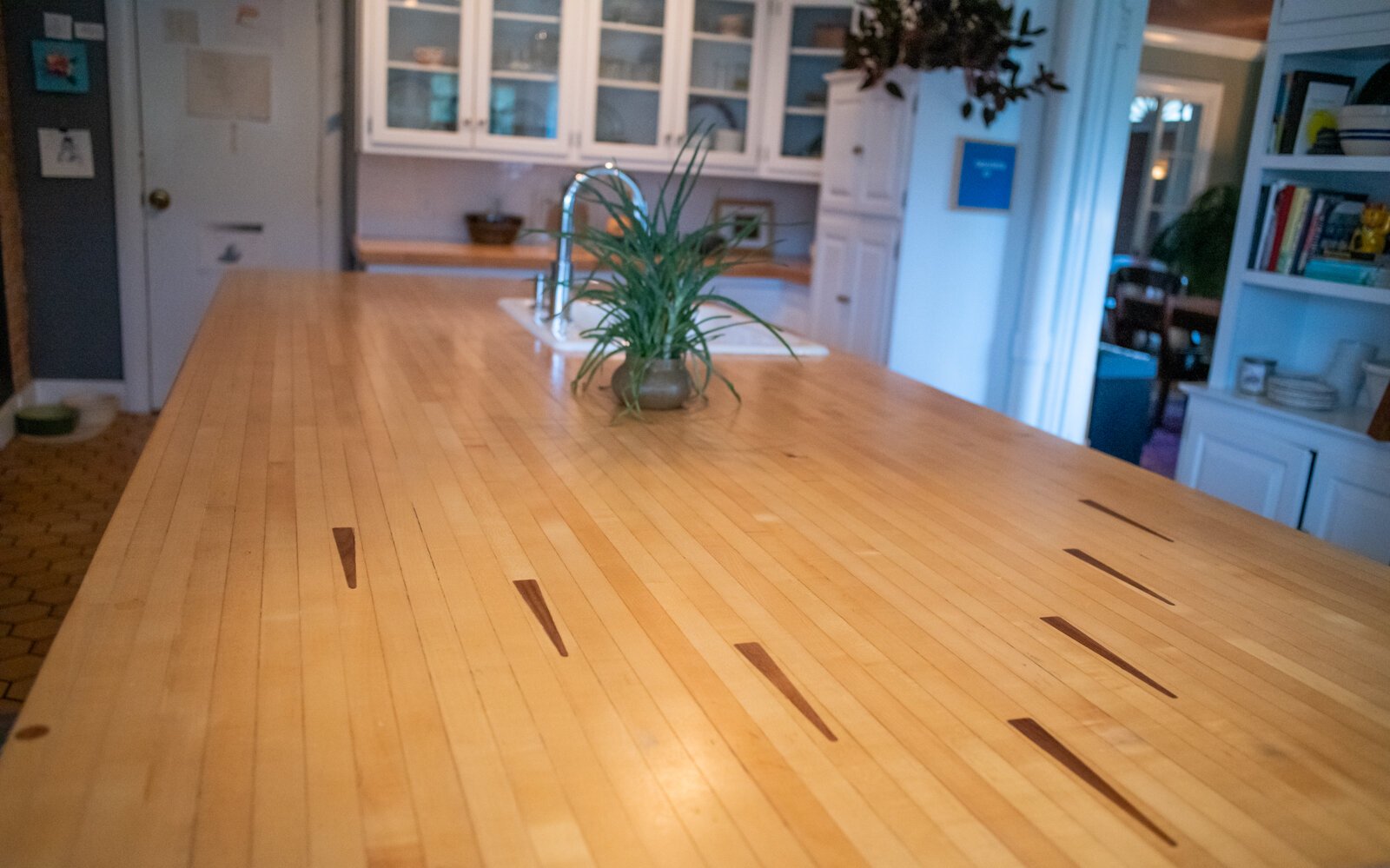 The kitchen table was created using reclaimed bowling alley wood.