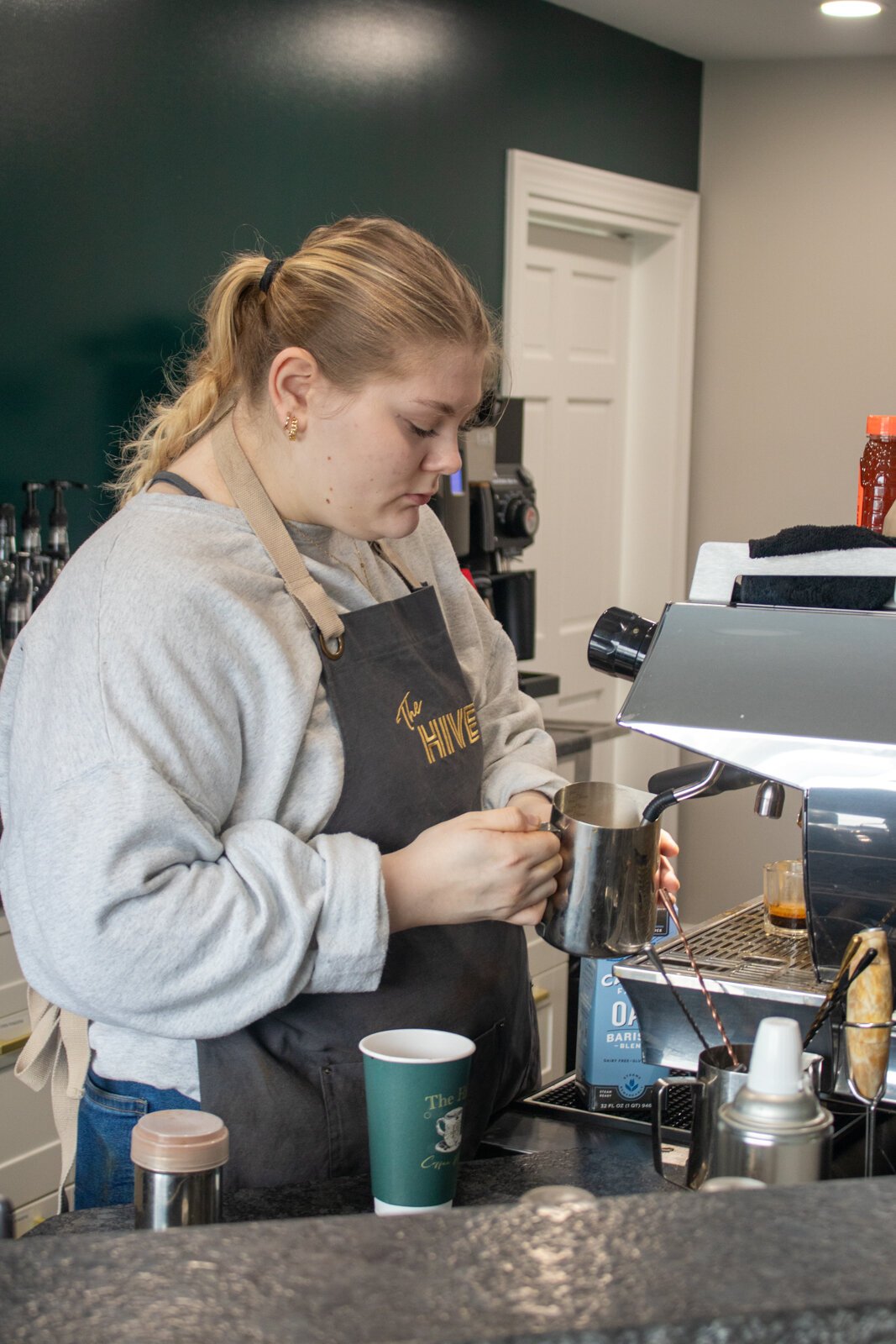 Baristas work to fill orders at The Hive.