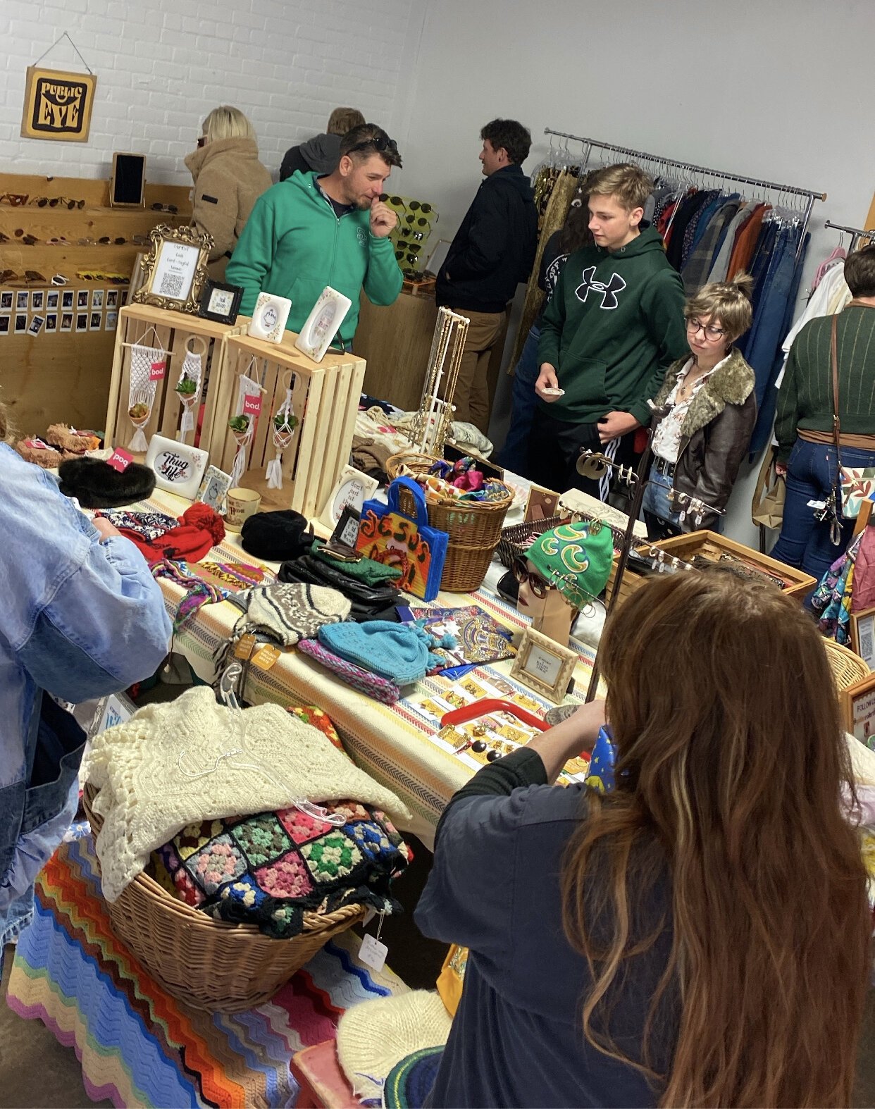 People looking through vintage finds at the Holiday Hootenanny in 2021.