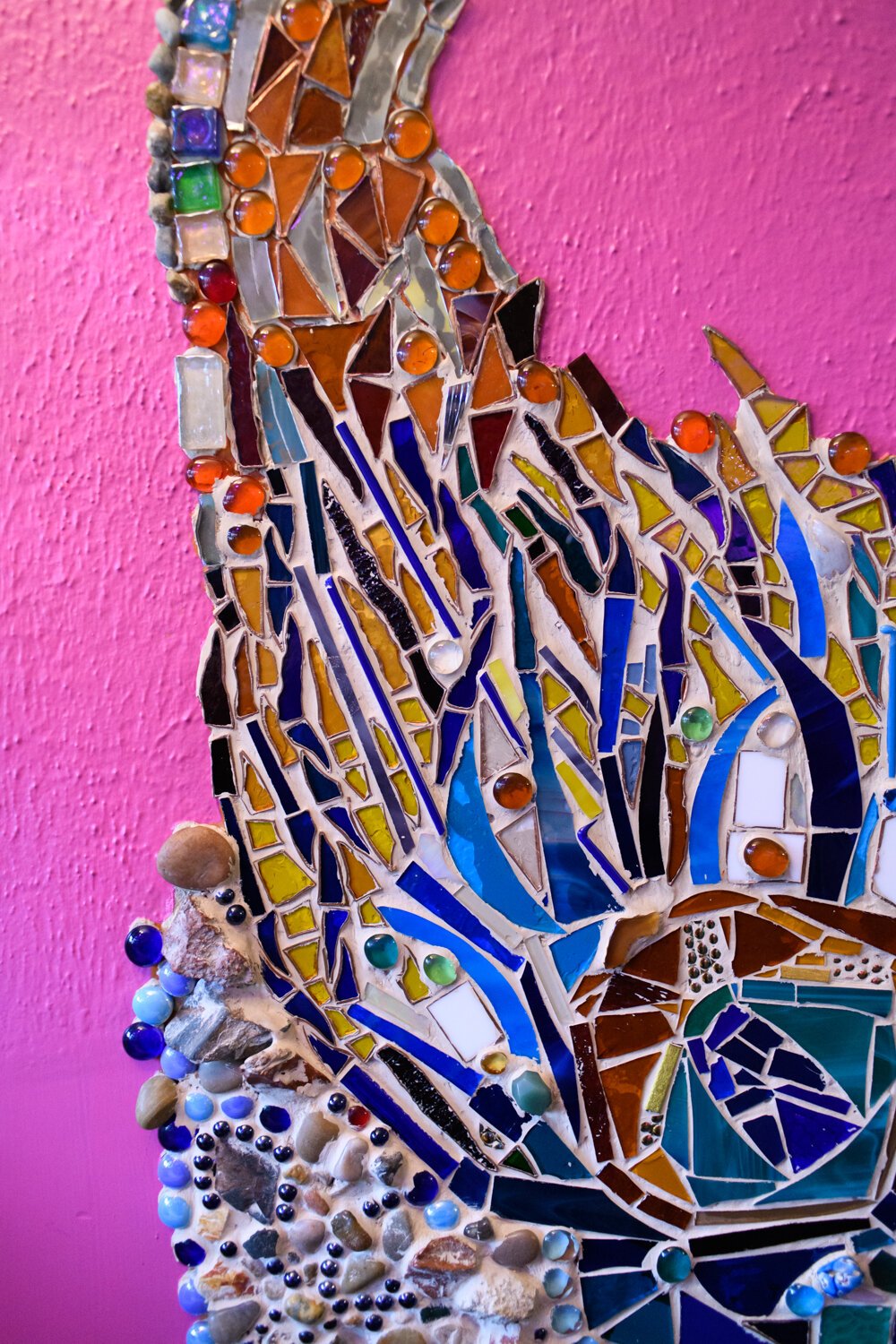 Colorful mosaic work on the Porter family fireplace.