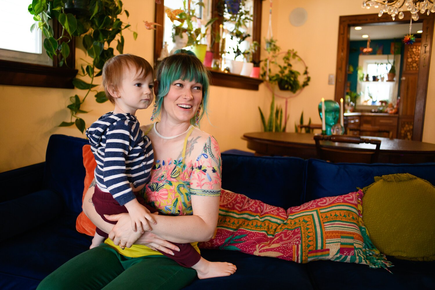 Lyndsy Rae Porter sits with Rew Jupiter, 1, in their living room on Thursday April 8, 2021. 