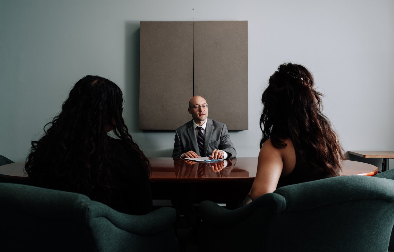 Immigration lawyer Brian A. Seyfried demonstrates what the initial meeting looks like with a new client using staff members at his office the Law Office of Brian A. Seyfried.