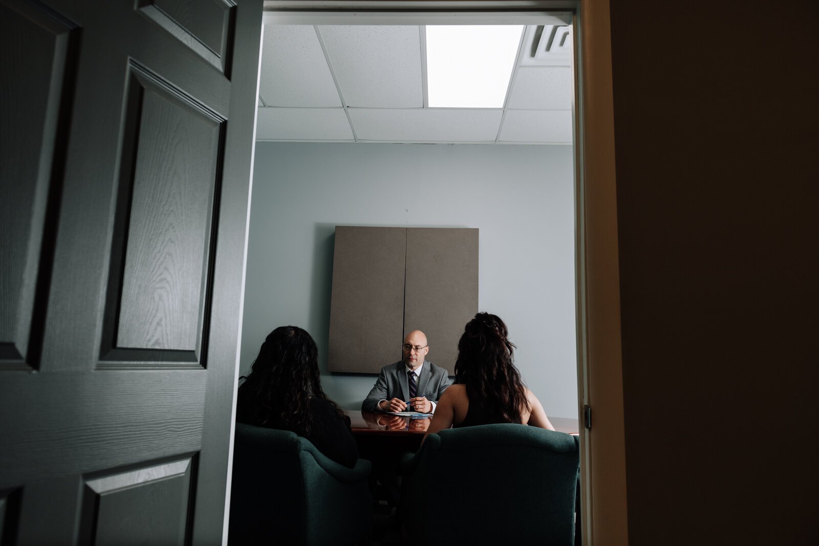 Immigration lawyer Brian A. Seyfried demonstrates what the initial meeting looks like with a new client using staff members at his office the Law Office of Brian A. Seyfried.