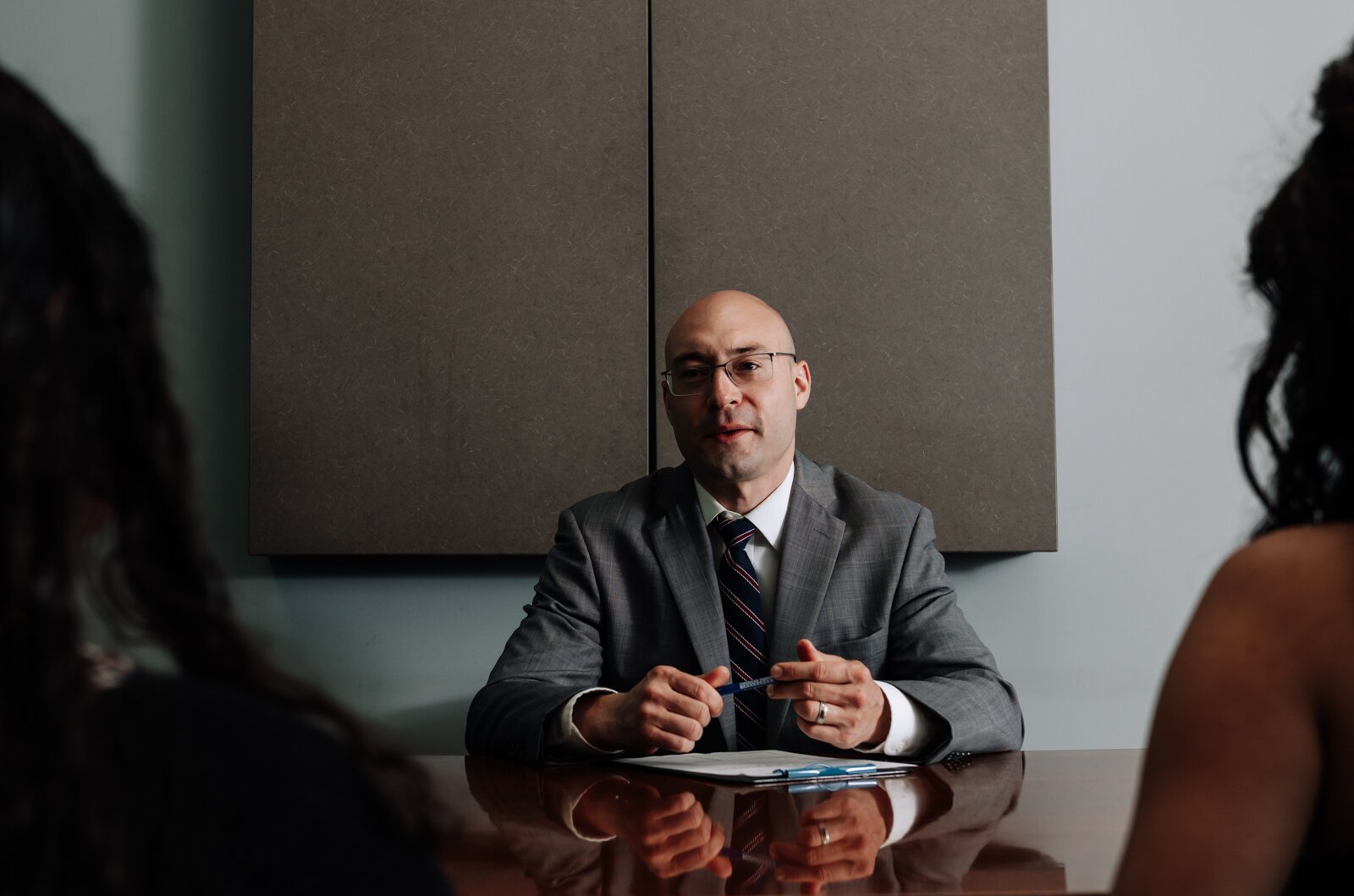 Immigration lawyer Brian A. Seyfried demonstrates what the initial meeting looks like with a new client using staff members at his office the Law Office of Brian A. Seyfried.