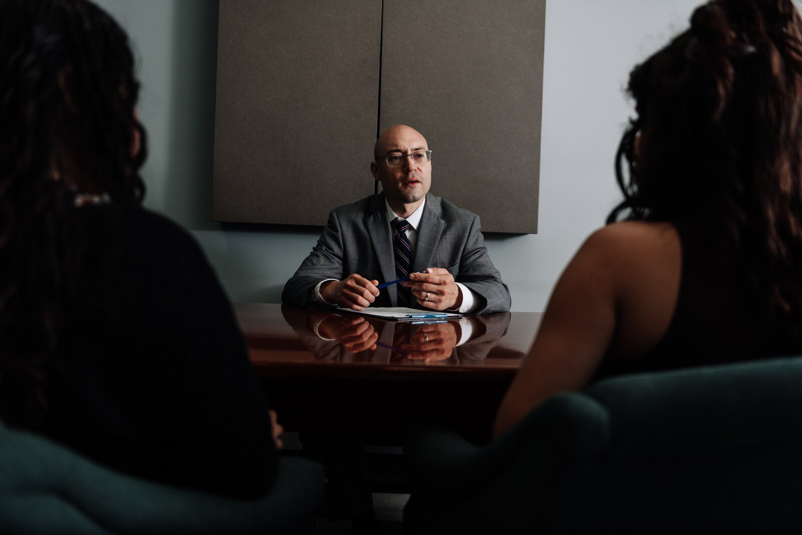 Immigration lawyer Brian A. Seyfried demonstrates what the initial meeting looks like with a new client using staff members at his office the Law Office of Brian A. Seyfried.