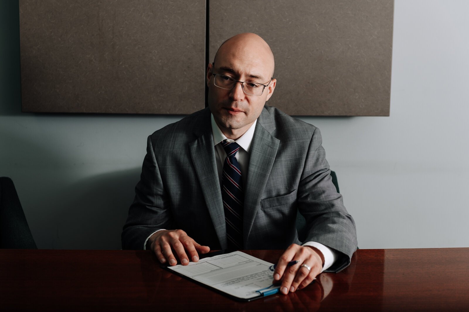 Immigration lawyer Brian A. Seyfried fills out a new client form at his office the Law Office of Brian A. Seyfried.