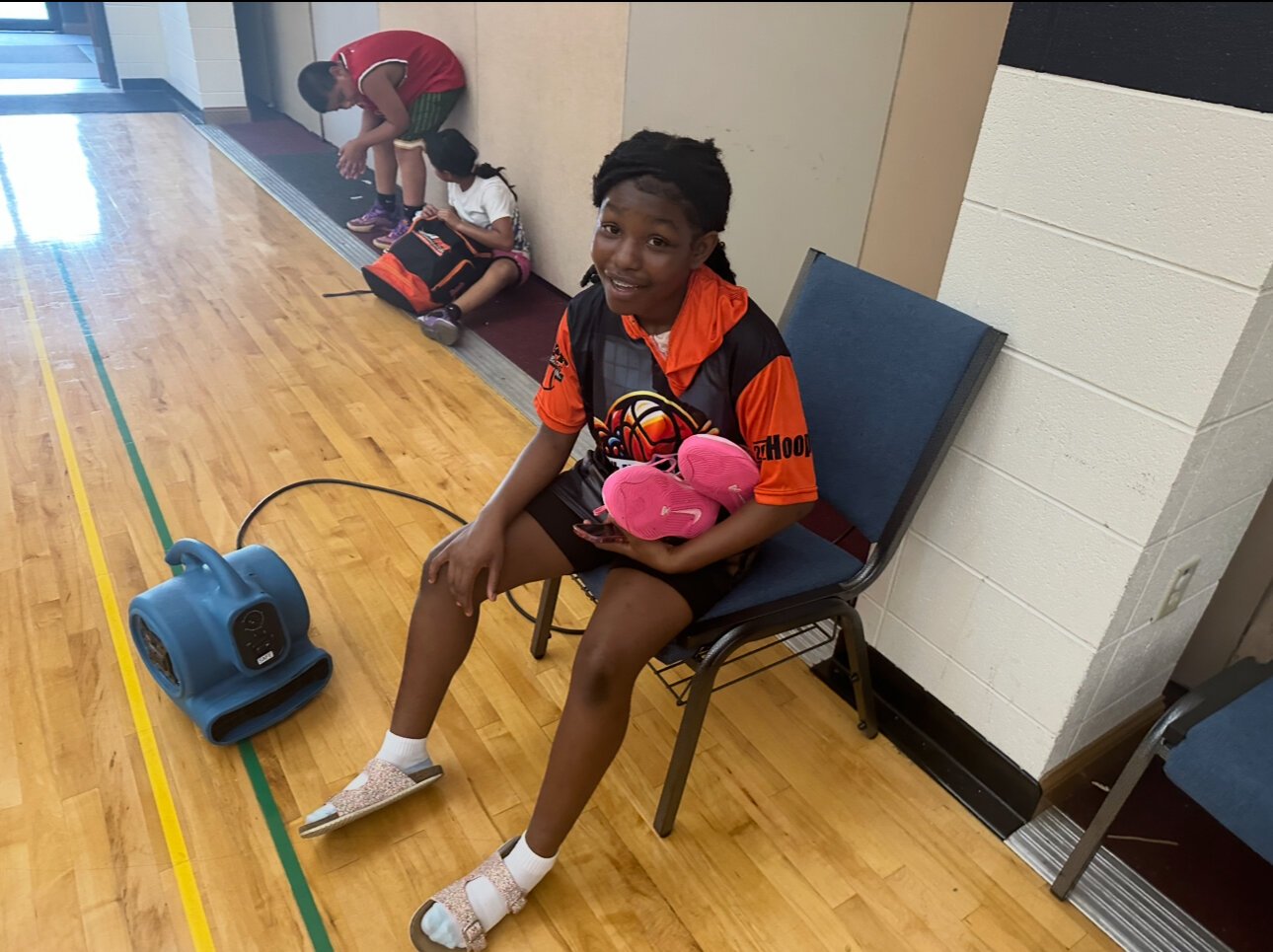 A’Moni Owens-Briggs, 12, plays for the Nike Lady Gym Rats and is coached by Miller.