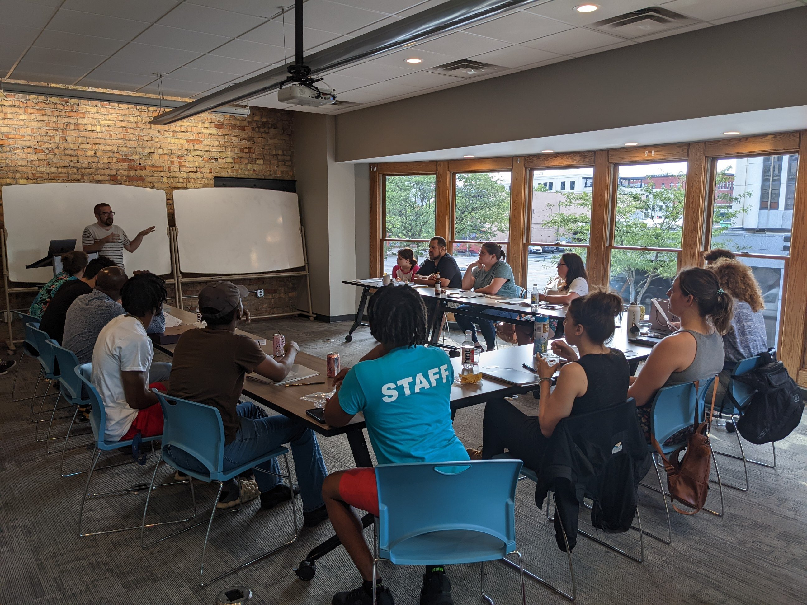 The first 15 cohorts of the Creative Assembly listen to Dan Swartz of Start Fort Wayne at a meeting. 