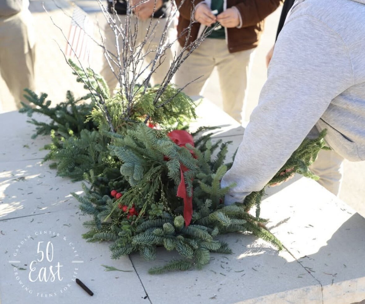 Students help design, plant and maintain 52 planter boxes along the streets of Wabash.