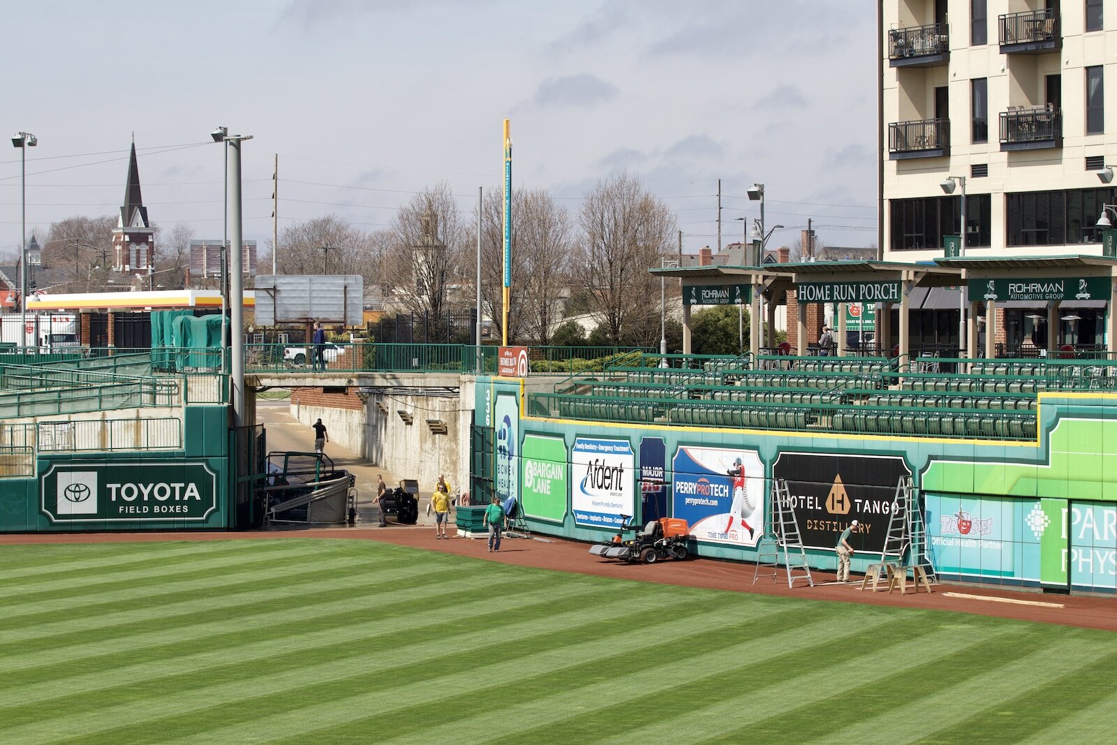 Crews work to prepare the ballpark for Opening Day.