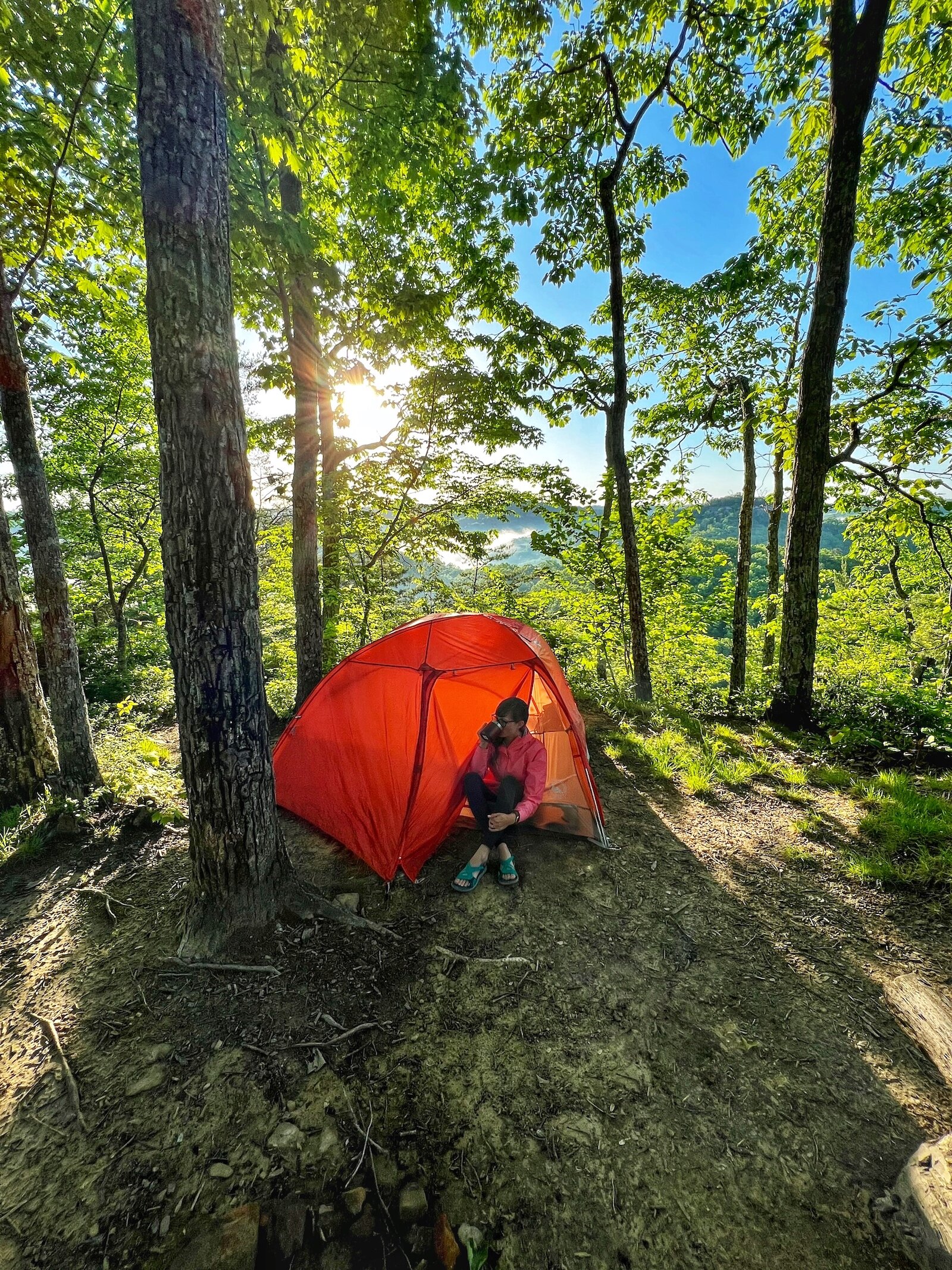 Camping at Red River Gorge in Kentucky, Alexys Esslinger relaxes outside her tent.