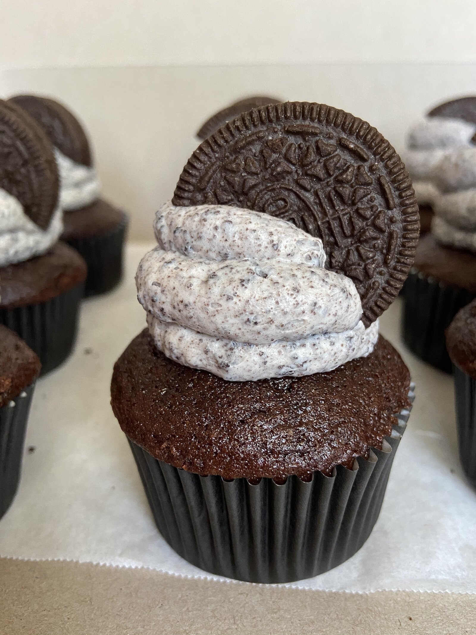 A cookies n' cream cupcake, made by Puff's Pastries.