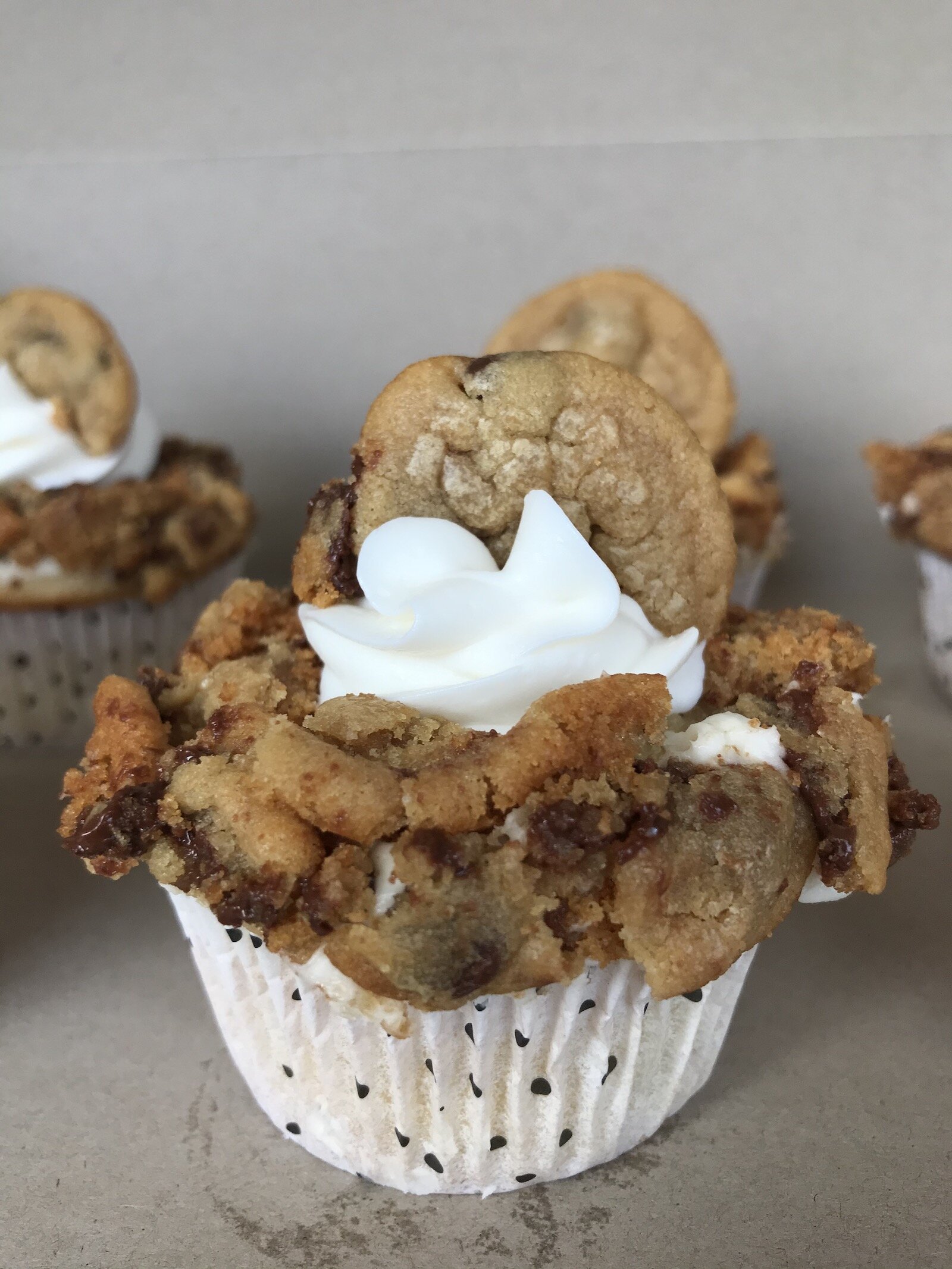A cookie dough cupcake, made by Puff's Pastries.