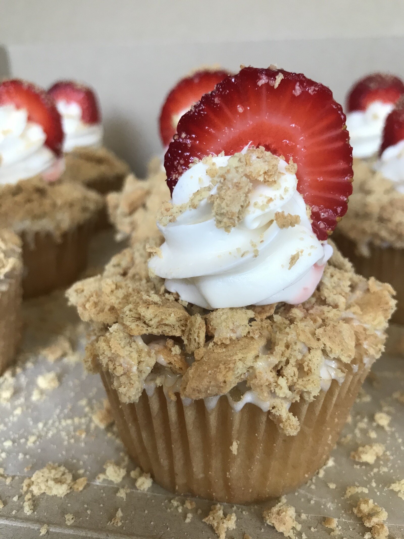 A strawberry shortcake cupcake, made by Puff's Pastries.