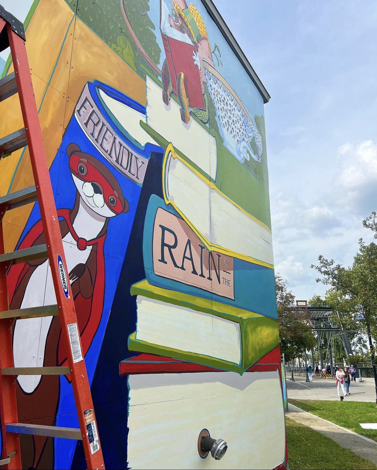 A new “Only Rain in the Drain” mural from Alexandra Hall is currently in progress at TJ Nowak Supply.