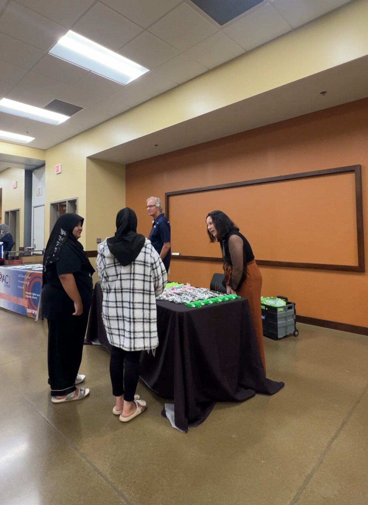 Employers speak with potential employees at a recent job fair.