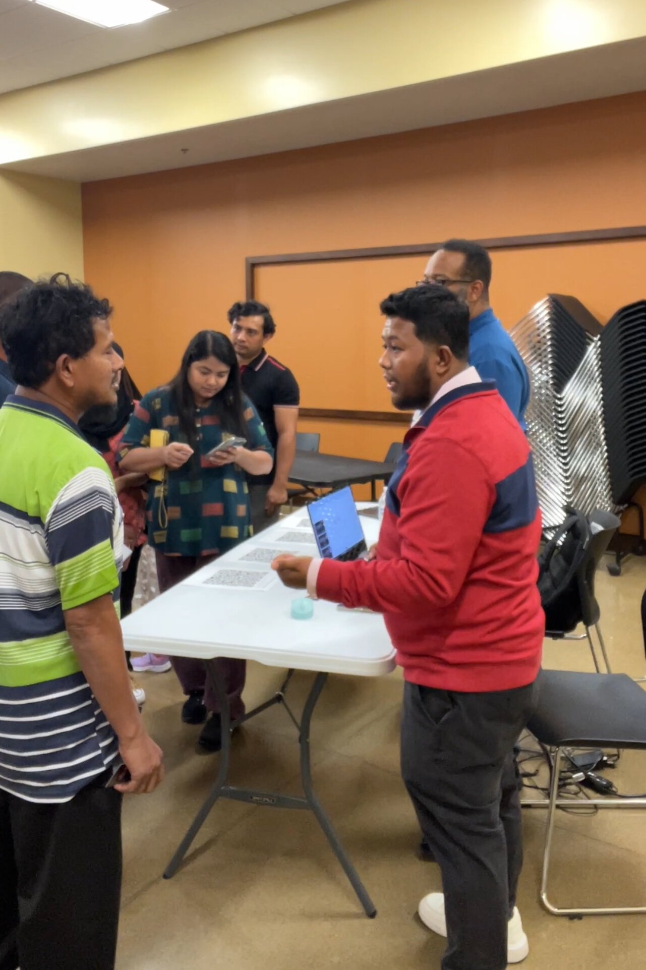 Might Might speaks with attendees at a recent job fair.