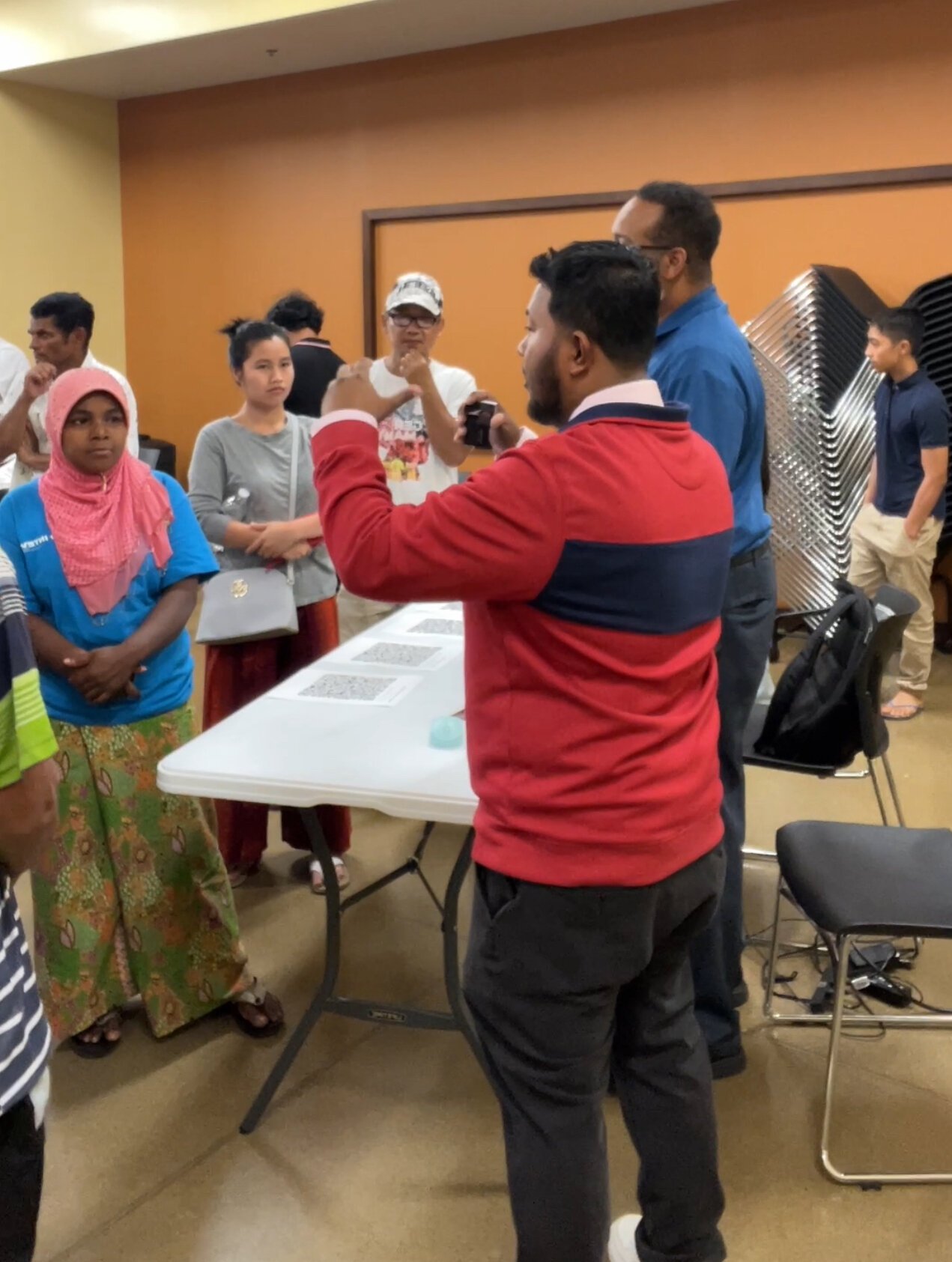 Might Might speaks with attendees at a recent job fair.