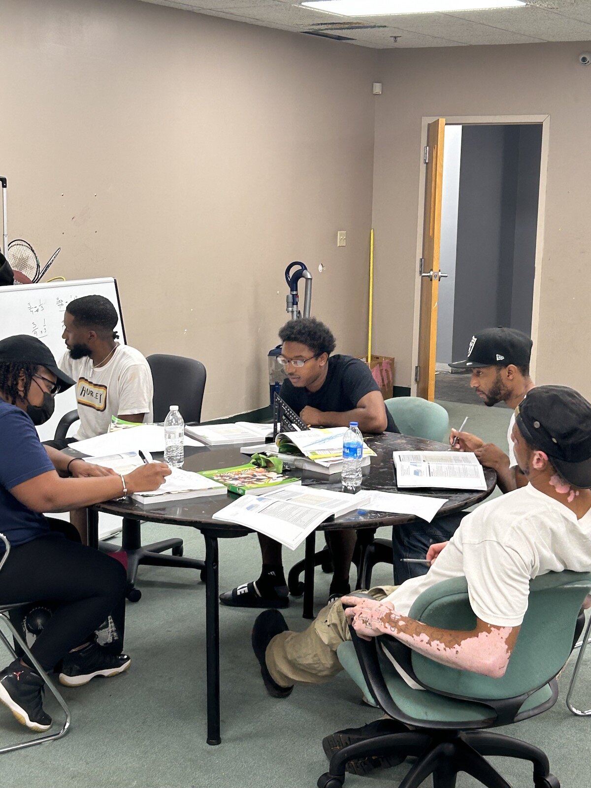 Johnson's on-the-job apprenticeship model ensures that individuals earn an income and gain the credentials they need to stand out in industries like carpentry and construction.