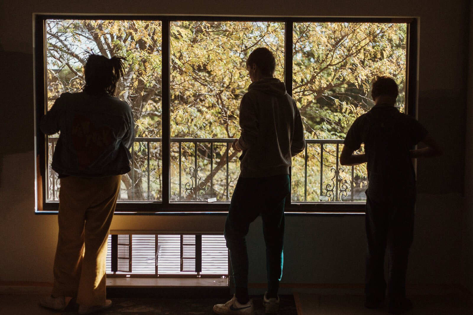 Students cleaning, vacuuming, taping, and prepping walls for paint at the YWCA's new facility, as part of a week-long Pre-Employment Transition Services project.