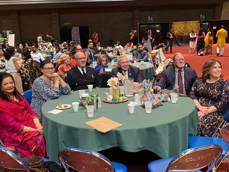 Mayor Tom Henry and Fort Wayne Fire Chief Eric Lahey watch the cultural program at Sangam Diwali 2022.