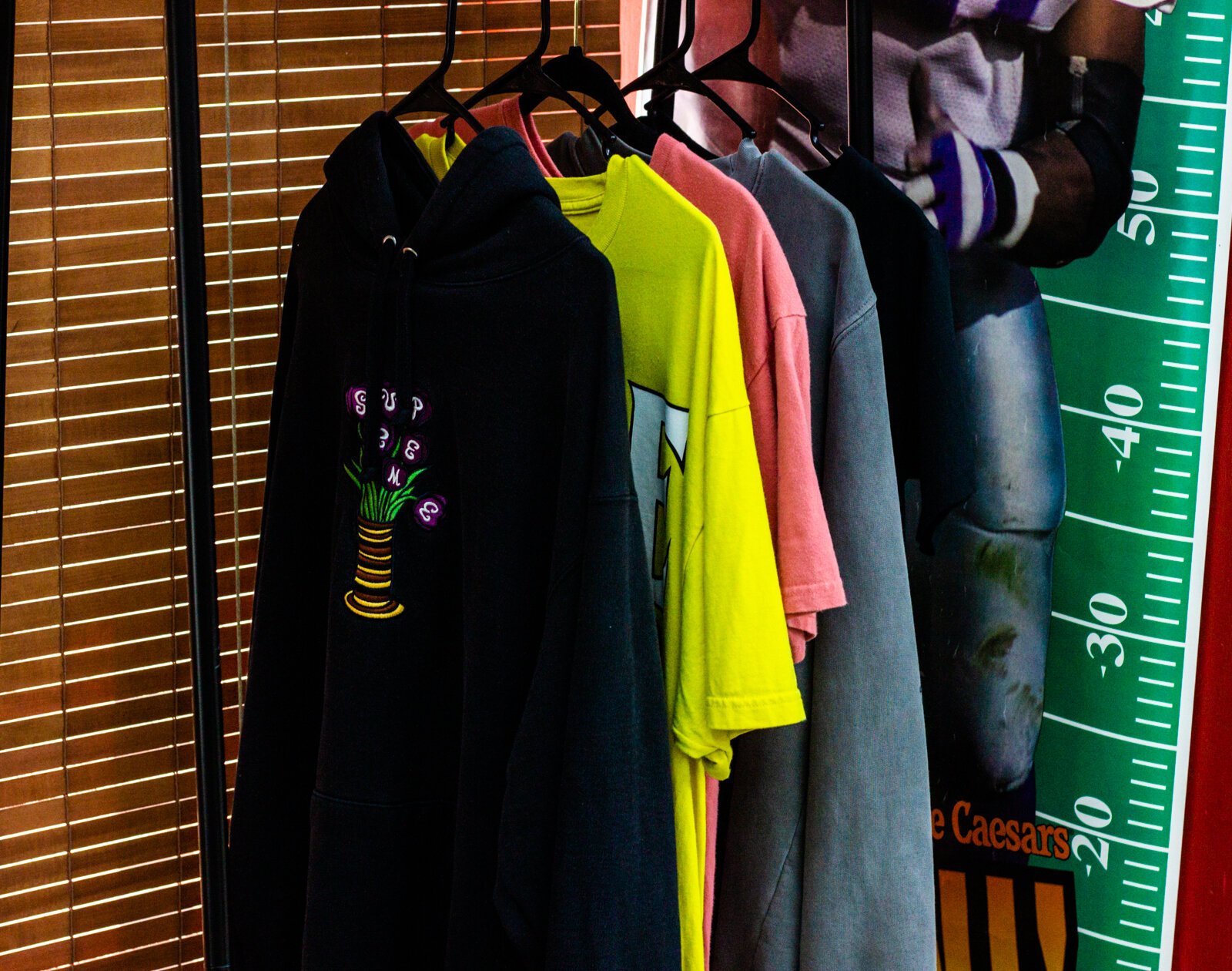 Deadstock Vintage sells a colorful assortment of sneakers, hats, tees, jeans, jackets, and knits.