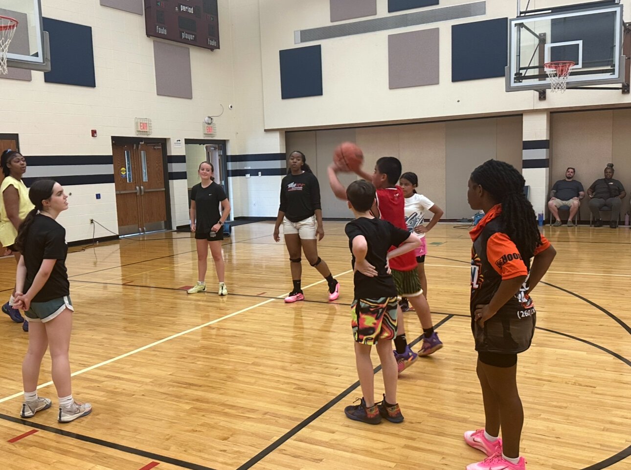 Players run drills to help build their basketball skills with Coach J.