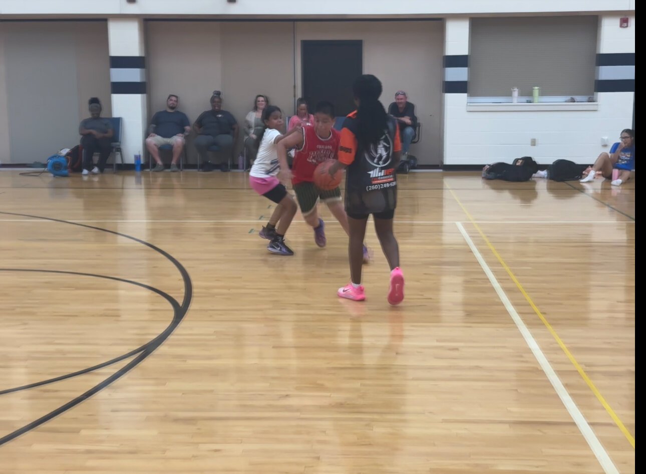 Players run drills to help build their basketball skills with Coach J.