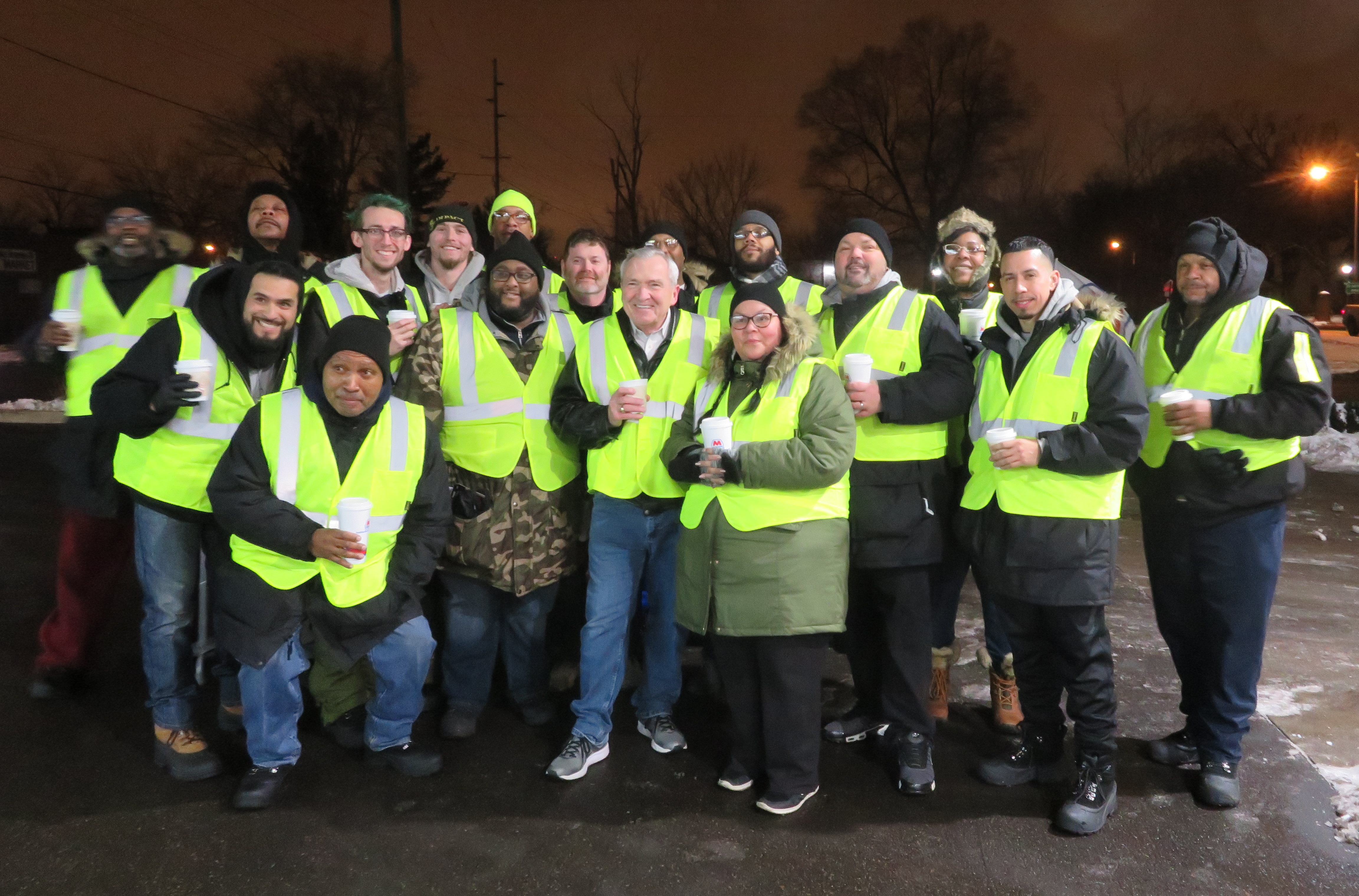 Members of the TenPoint Coalition Foot Patrol post with Mayor Tom Henry.