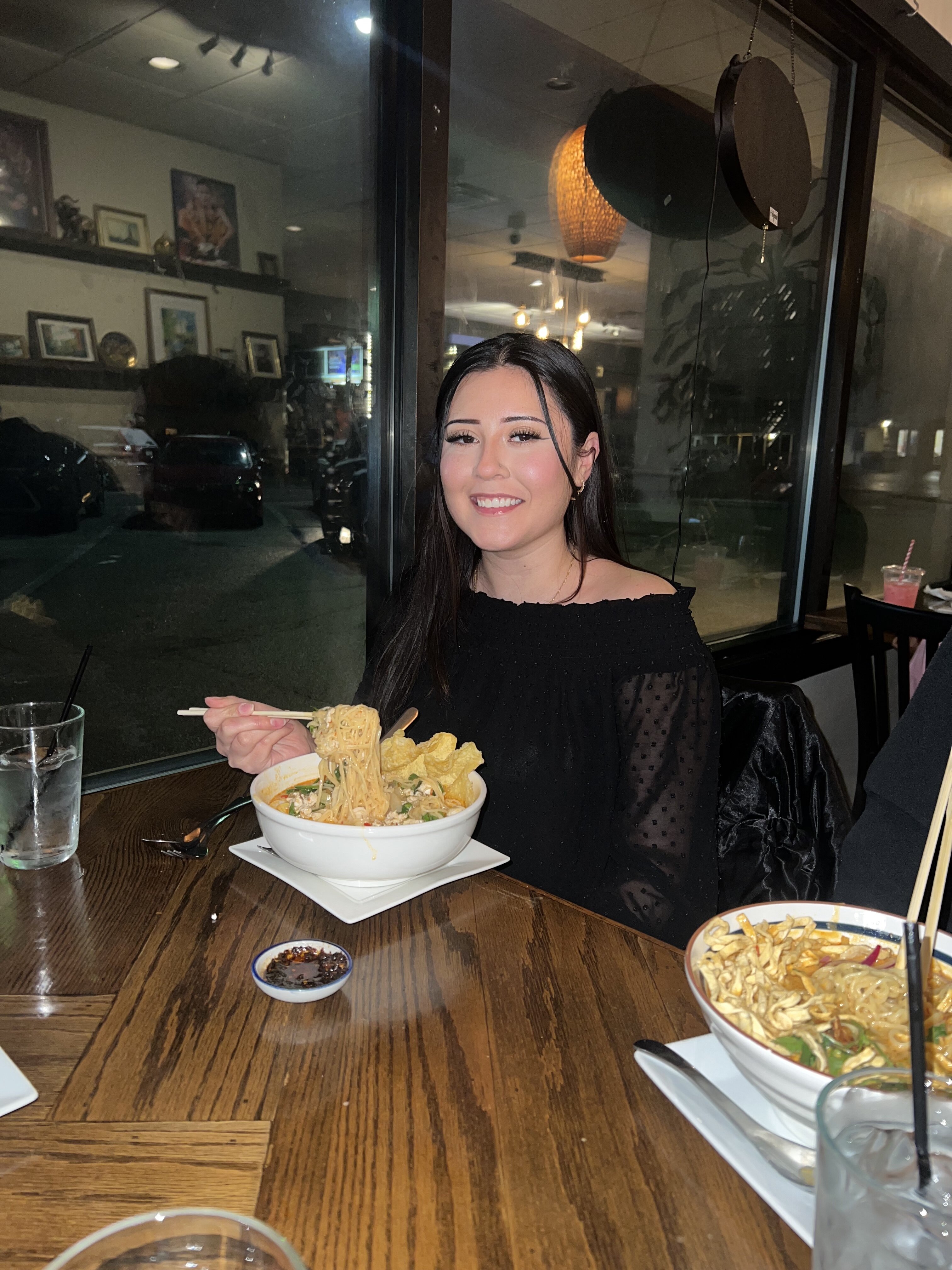 Eat With Bella at Bangkok Bistro enjoying the curry noodle soup.