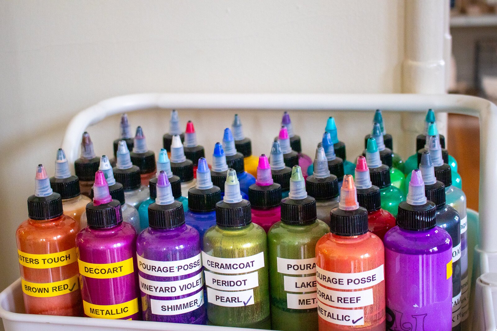 Paints used to create drip painting at Indigo Studio.