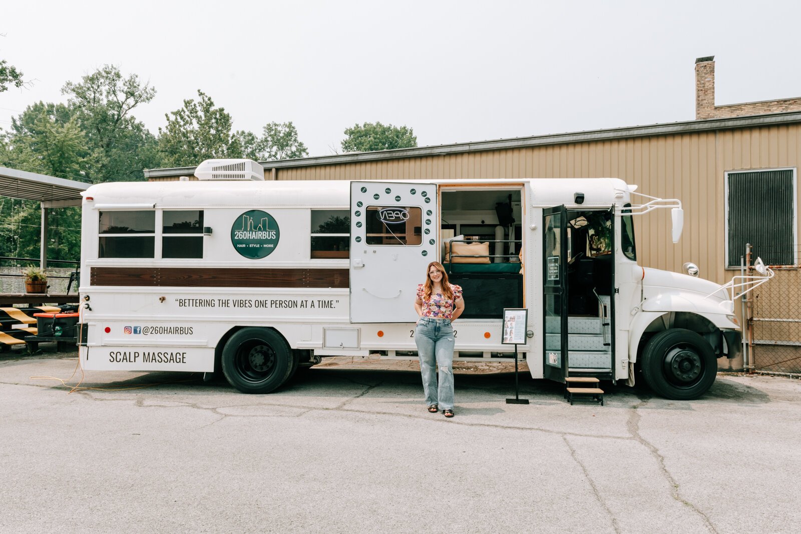 Owner Beth Morken in front of the 260HairBus that she renovated herself.