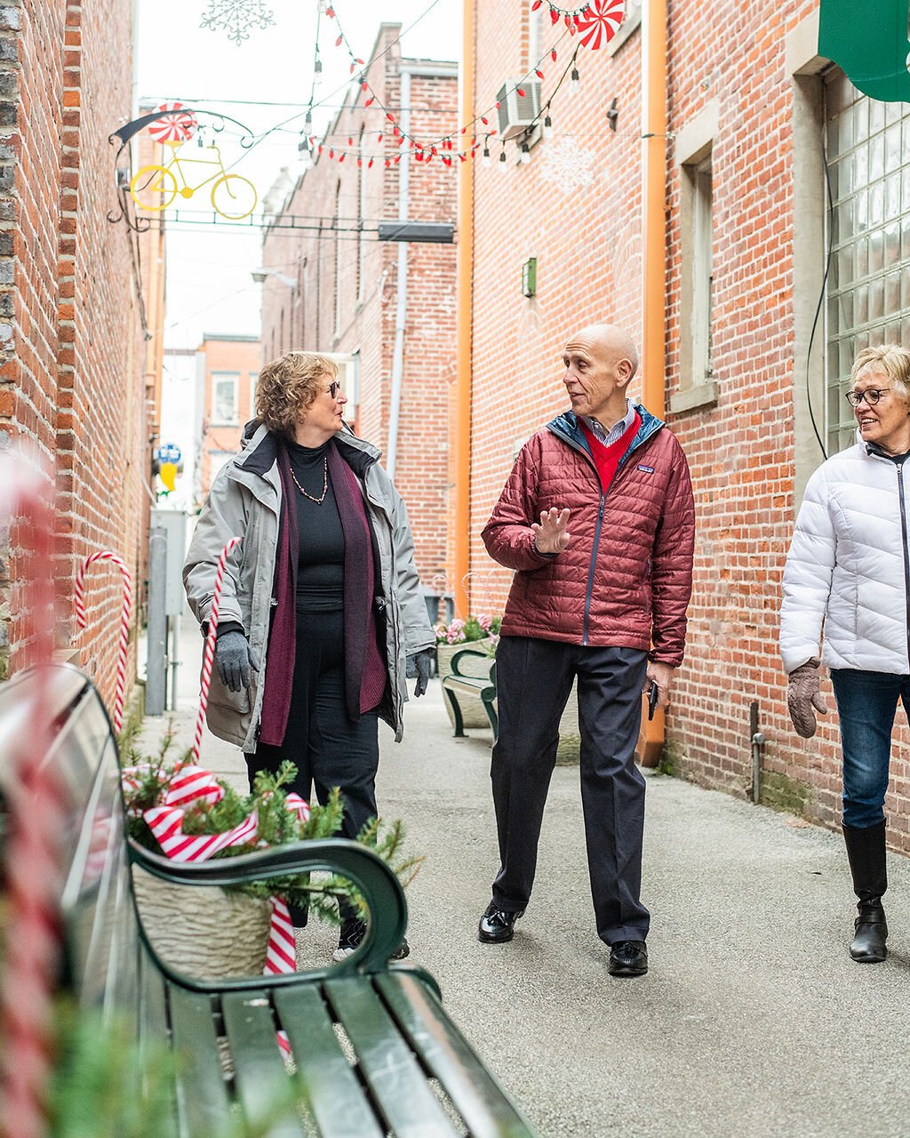 (Left to right) Jan Roland, Dave Haist, and Beverly Vanderpool walk through Downtown Wabash.