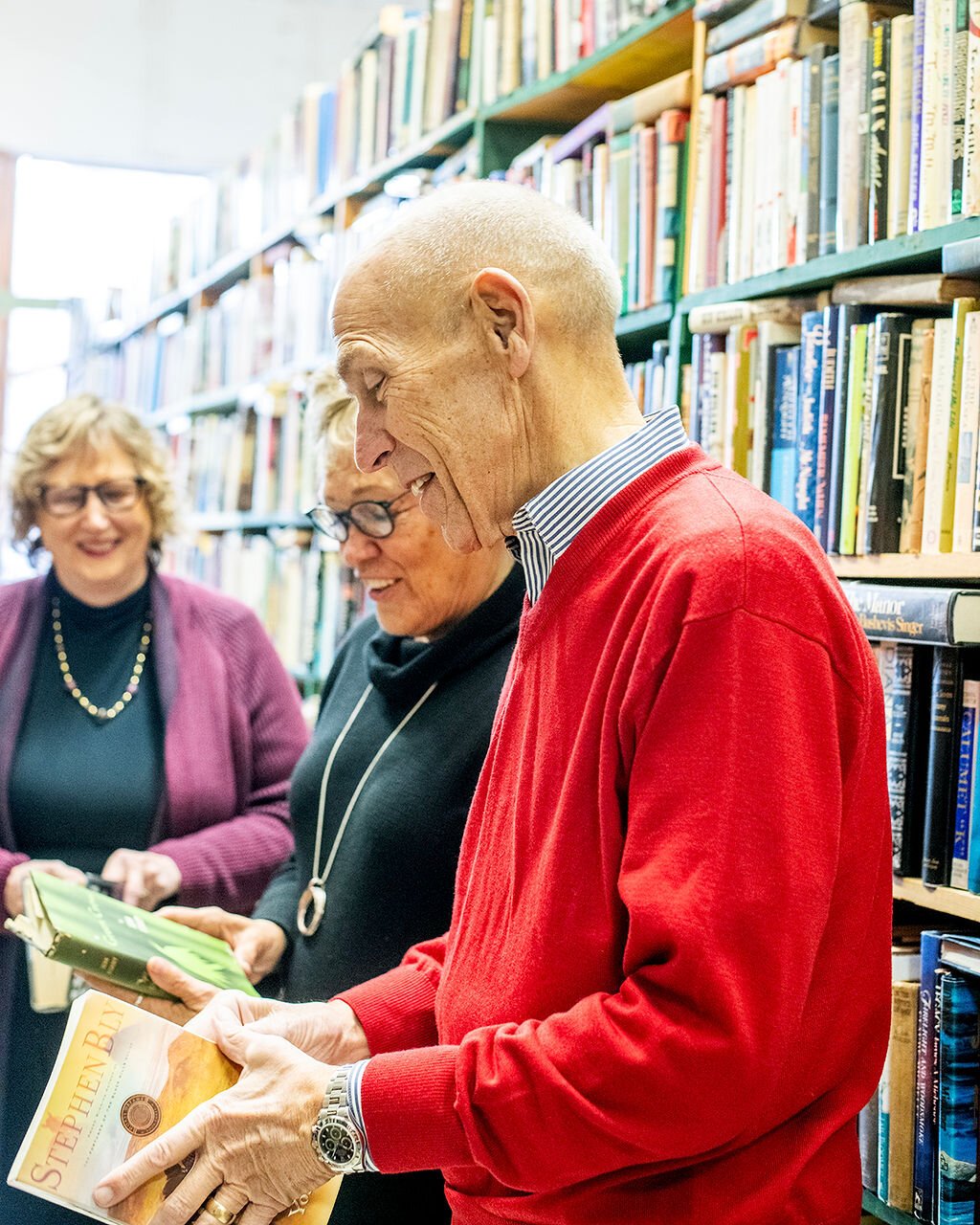 Retirees (left to right) Jan Roland, Beverly Vanderpool, and Dave Haist browse books at Reading Room Books in Wabash.