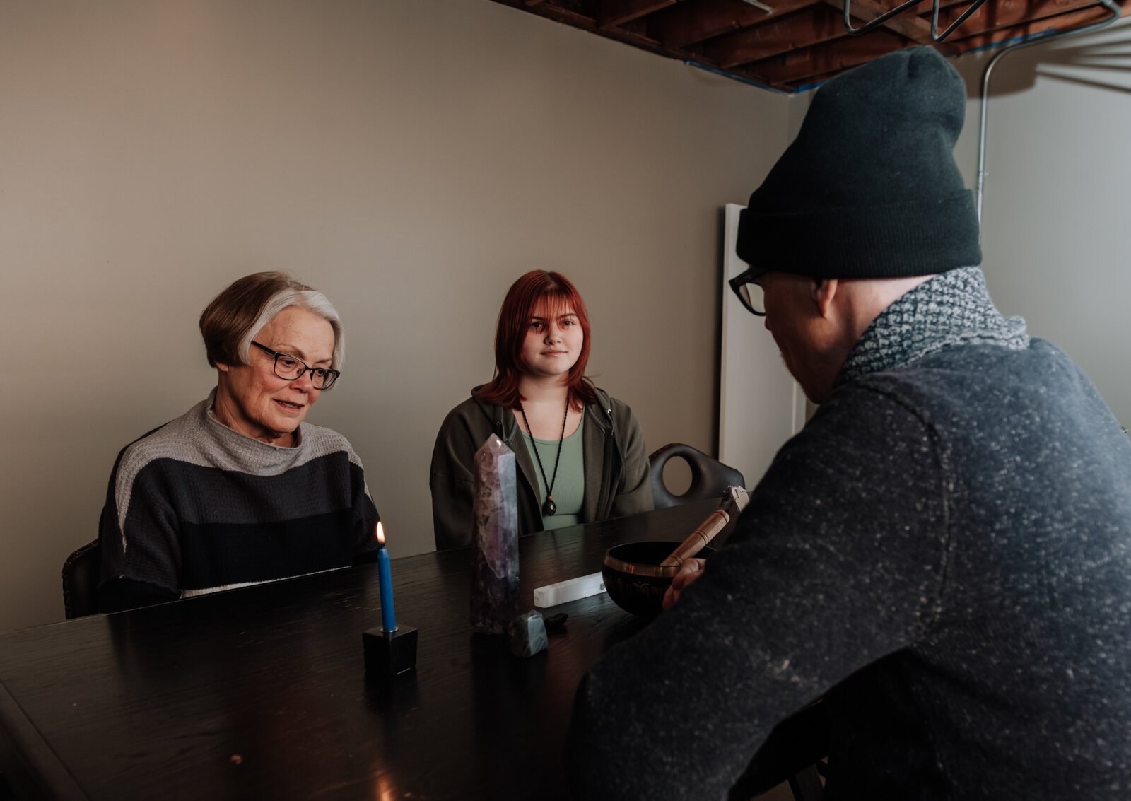 From right: Co-owner Rod Bice does a psychic medium reading for Max Jacobs and Jolene Holly at 2 Crazy Crystal Guys.