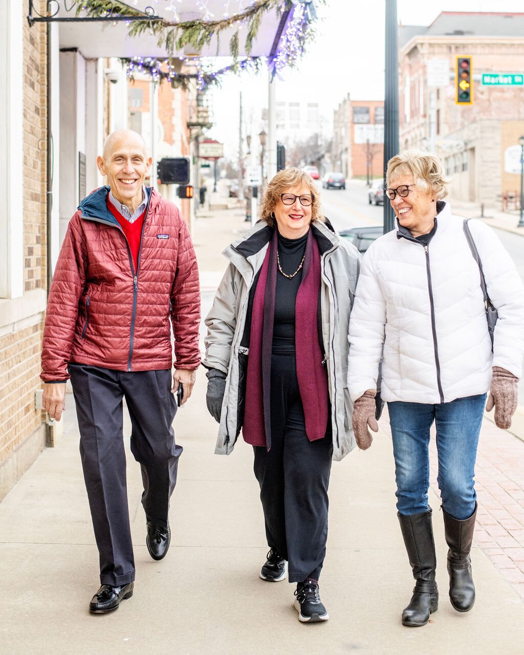 Retirees (left to right) Dave Haist, Jan Roland, and Beverly Vanderpool walk through Downtown Wabash.