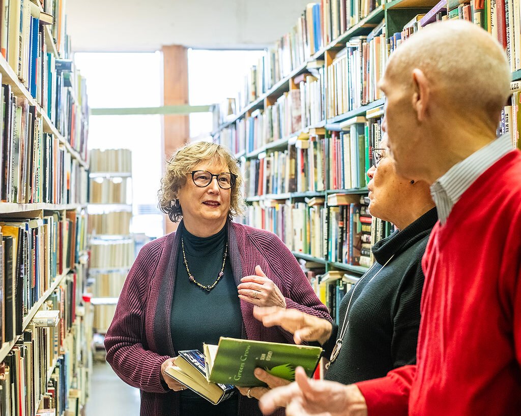 Retirees (left to right) Jan Roland, Beverly Vanderpool, and Dave Haist browse books at Reading Room Books in Wabash.