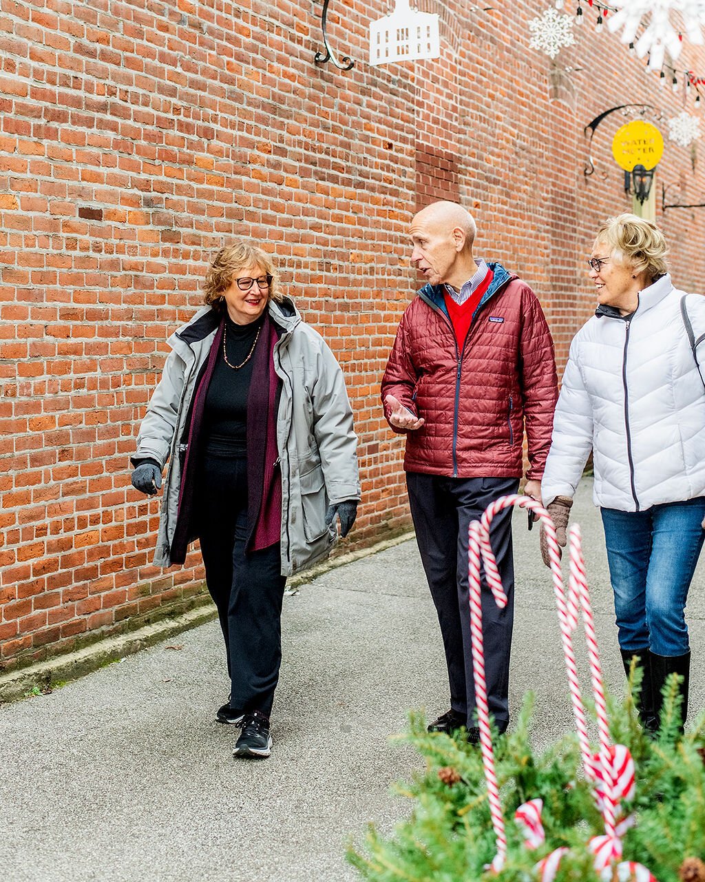 (Left to right) Jan Roland, Dave Haist, and Beverly Vanderpool walk through Downtown Wabash.