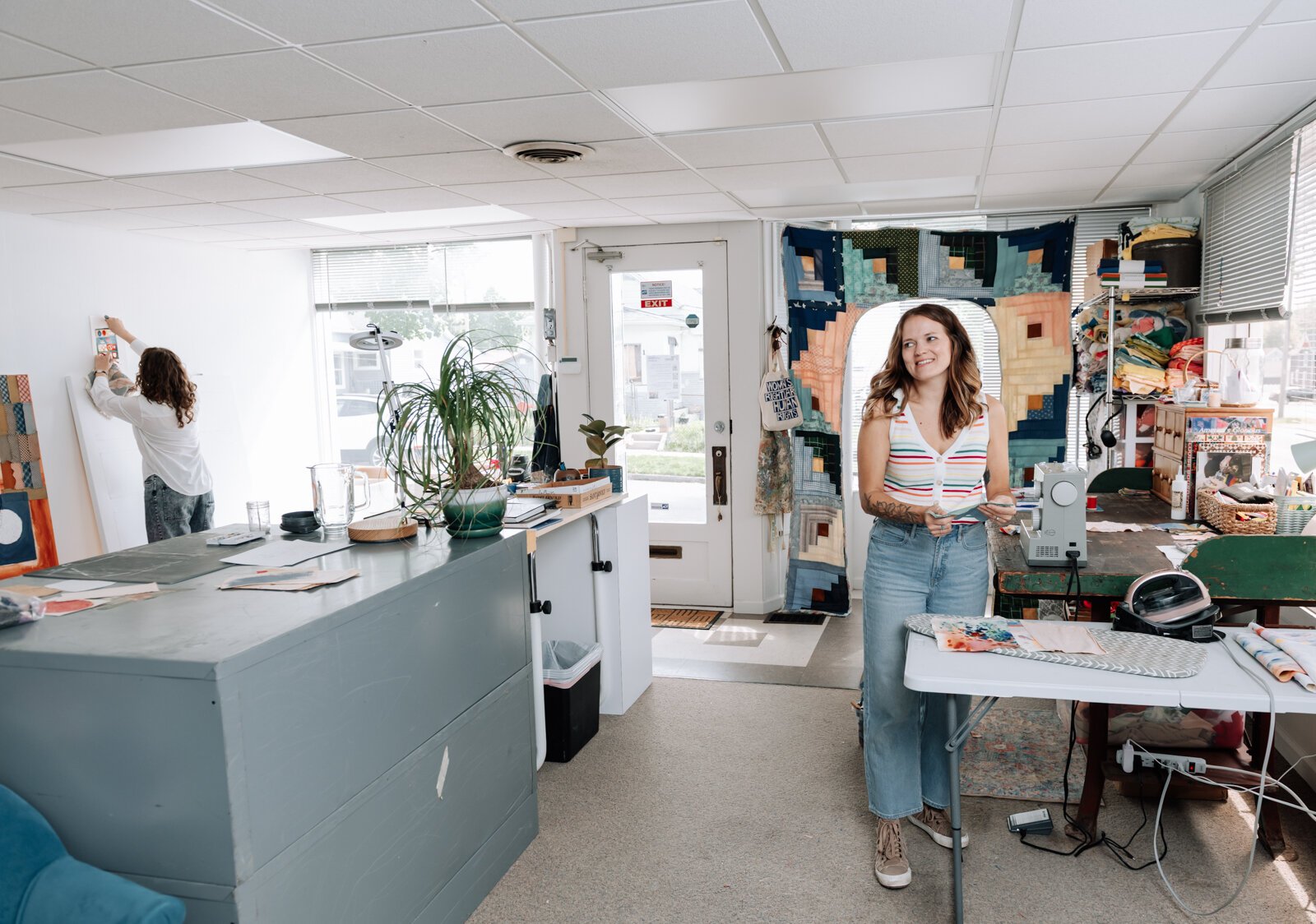 o-Directors of Kinhouse Gallery Dana Caldera, left, and Kaylan Buteyn work together in their studio space.