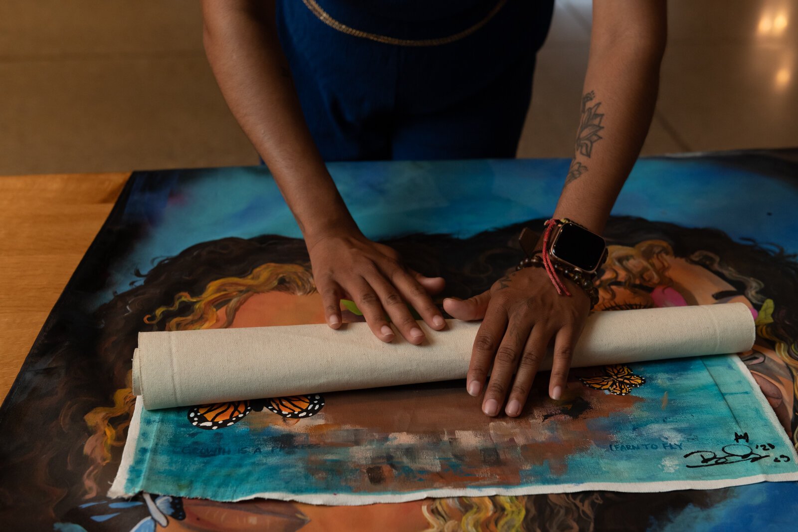 BonJo rolls her art pieces.