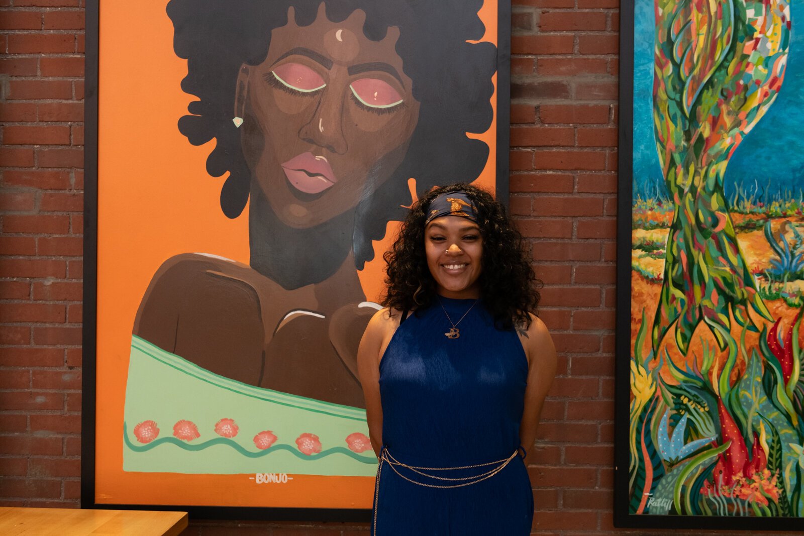 Local artist BonJo in front of her piece "7 Dulce" at Union Street Market at Electric Works.
