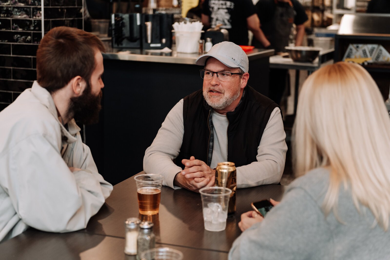 Jason Mann talks with other creatives at the Creator Space 1 Year Bash.