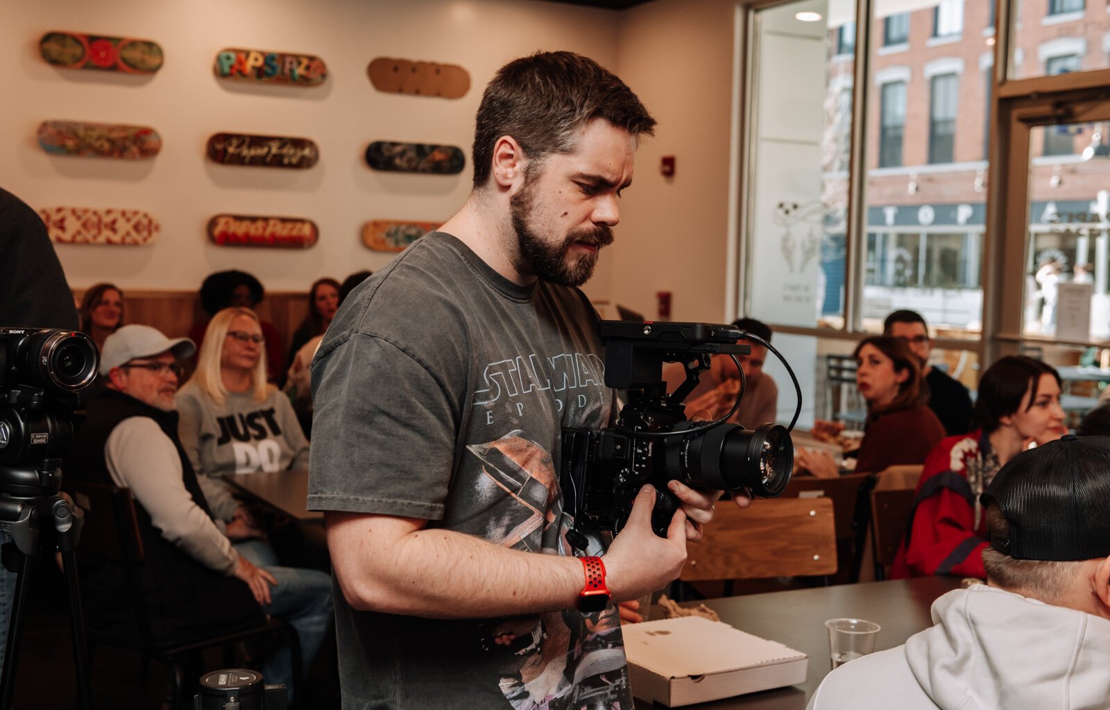 Zach Vessels, founder of Creator Space, films during the Creator Space 1 Year Bash.