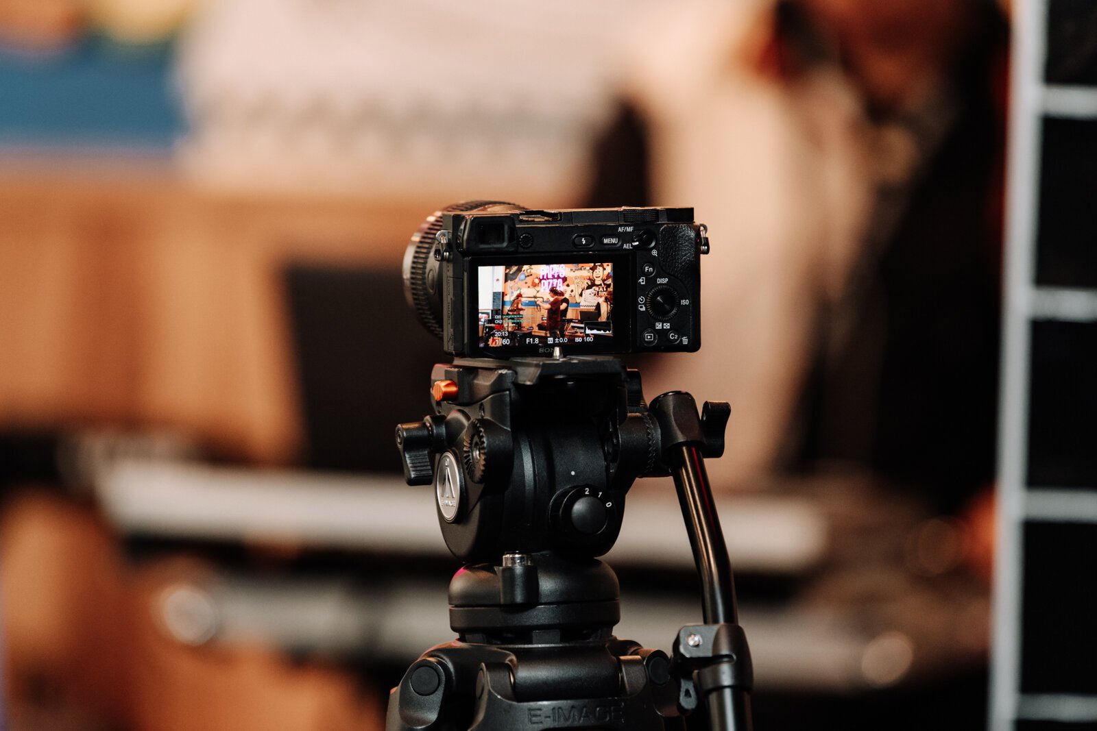 A camera filming during the Creator Space 1 Year Bash at Papi's Pizza on The Landing.