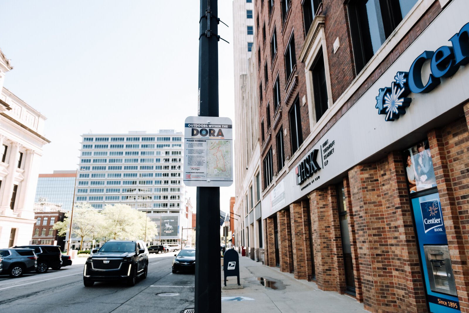 A sign at Berry Street and Calhoun Street reminds people of the rules within the new Downtown DORA (Designated Outdoor Refreshment Area).