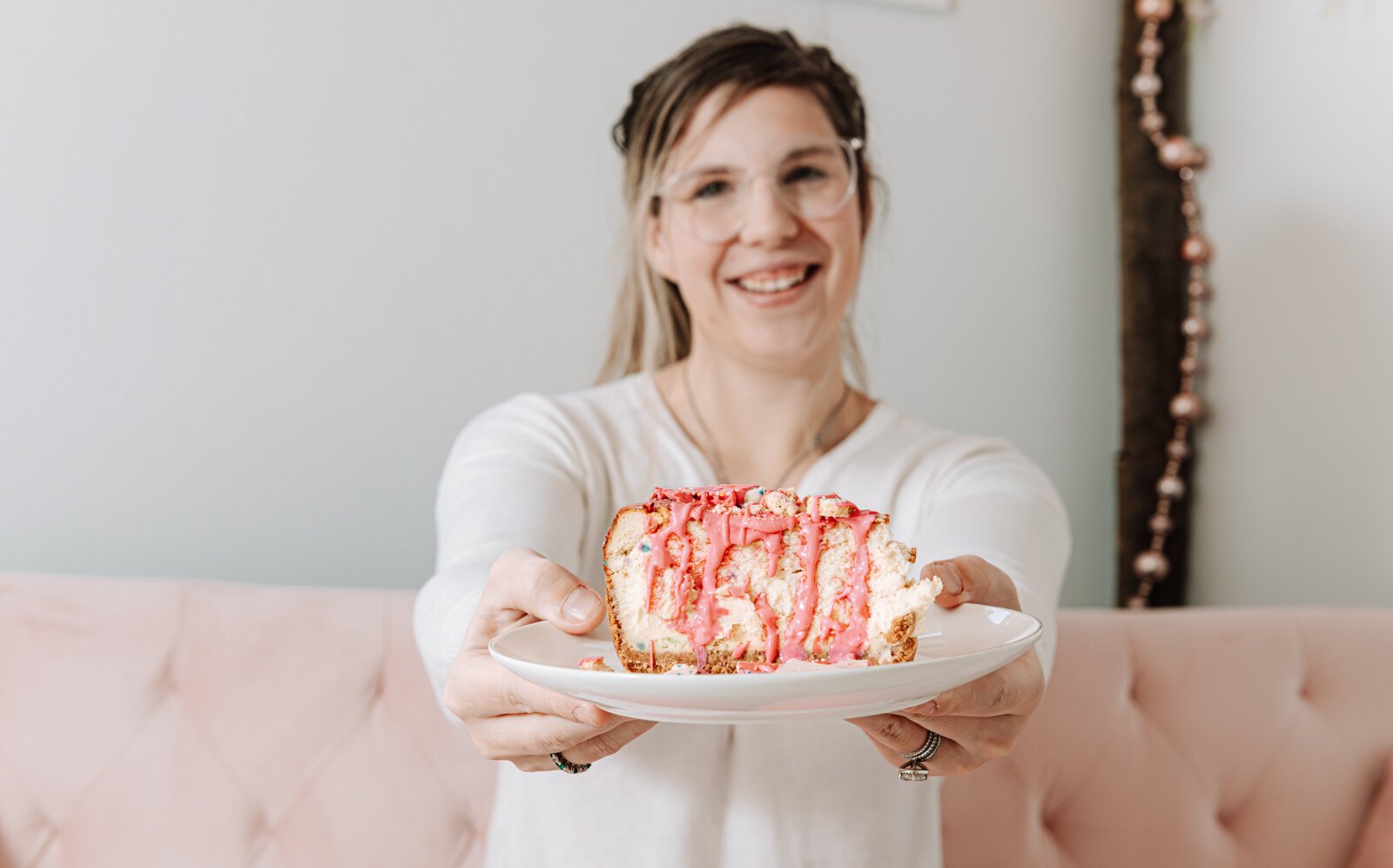 Owner and founder Grayce Holloway holds the frosted animal cookie cheesecake at Icing for Izaac, 243 Airport North Office Park, Fort Wayne, IN 46825.