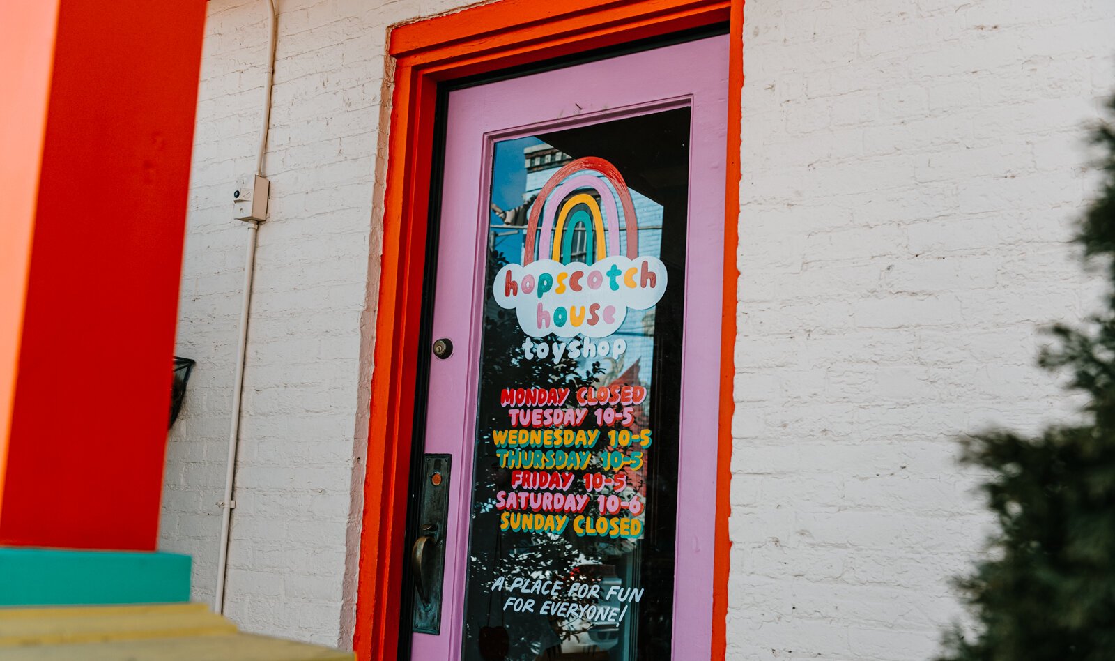 Justin Lim, owner of Old 5 and Dime Sign Co., hand painted the door at Hopscotch House on Broadway in Fort Wayne, IN.