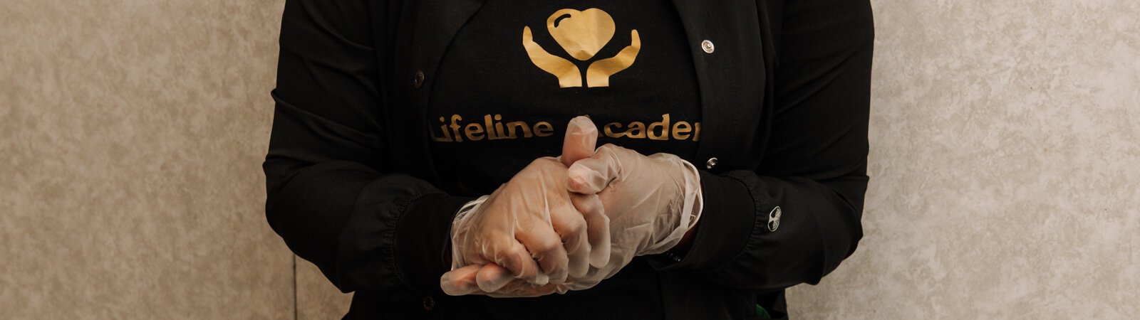 Student Ja'Lona Franklin puts on gloves while at Lifeline Academy, 1615 East Wallace Street, Fort Wayne, Indiana, 46803.