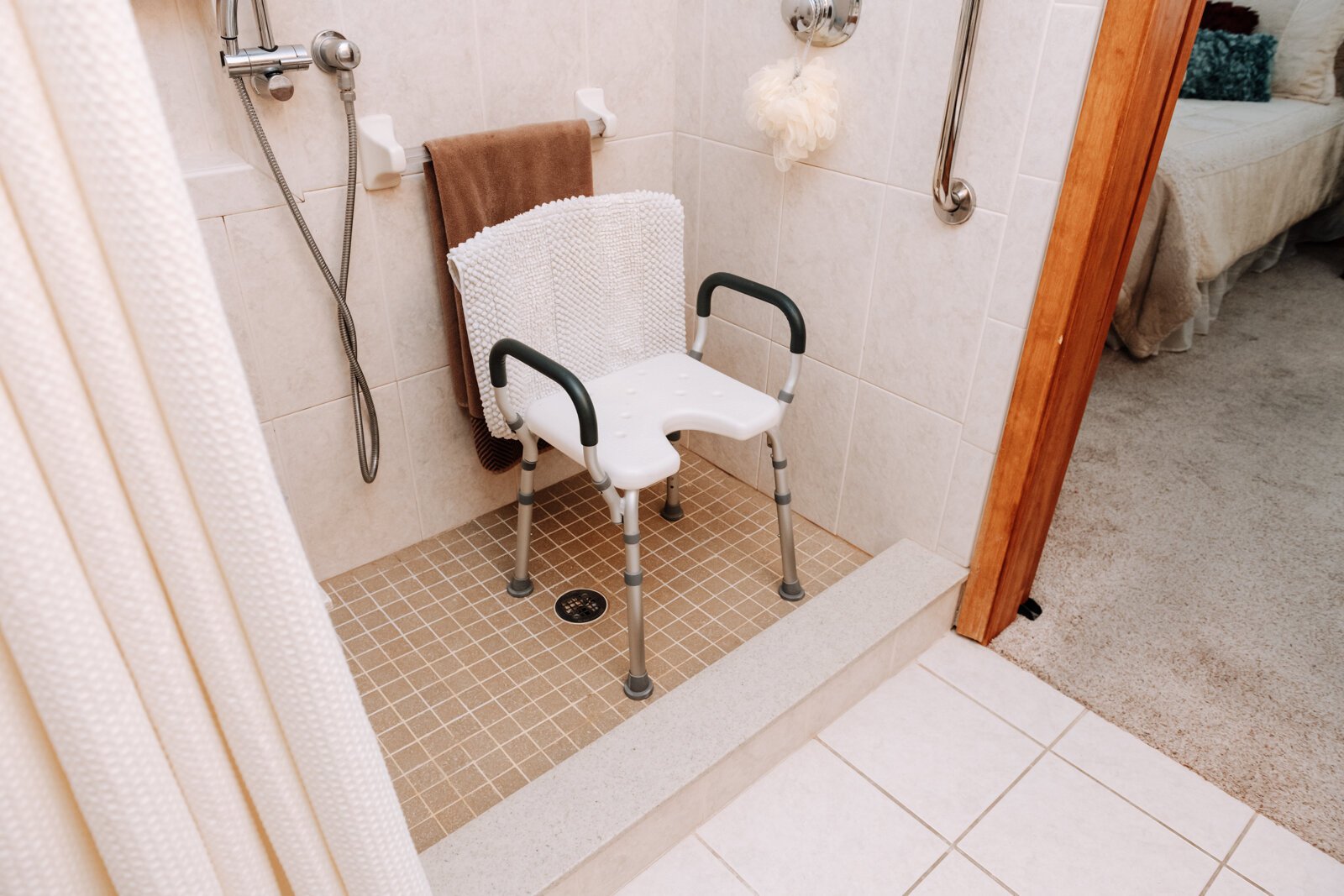 Because of the placement of the drain in the master suite bathroom at Ron Duchovic's home, the step into the shower could not be completely flattened, making it not accessible for a wheelchair user.
